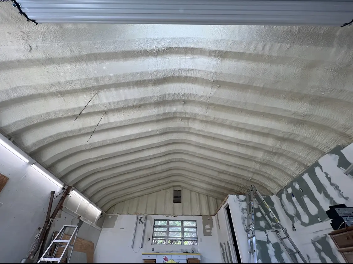 Spray polyurethane foam applied to the underside of a metal roof deck in Connerton